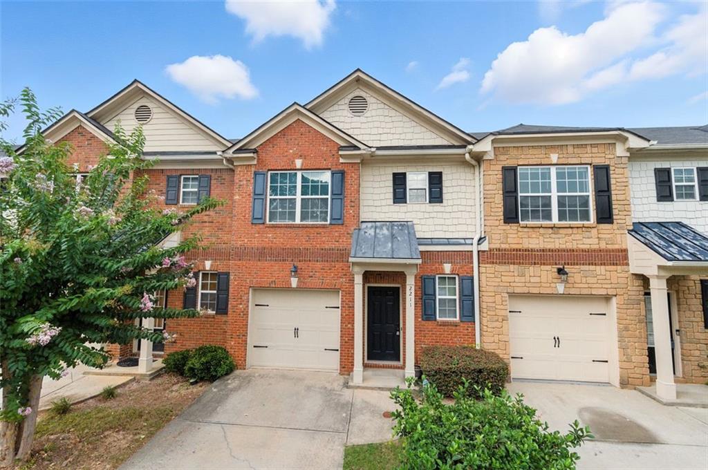 Updated & Move-In Ready! This 3 bedroom, 2.5 bathroom townhome at 2211 Ferentz Trace offers a low-maintenance lifestyle with key system upgrades already in place. Enjoy peace of mind with a brand new HVAC system and new water heater, plus hardwood flooring throughout the main level for a clean, modern feel. The main level features an open-concept fireside living room and dining area, perfect for everyday living and entertaining. The kitchen offers ample cabinet space and overlooks the main living area, while the half bath adds convenience for guests. Upstairs, you'll find three well-appointed bedrooms, including a spacious owner’s suite with an ensuite bath and walk-in closet equipped with built-in closet systems. Two additional bedrooms and a full hall bathroom complete the upper level. Out back, enjoy the private patio area and backyard - ideal for grilling, gardening, or relaxing outdoors. Conveniently located near shopping, dining, schools, and major highways - this home is ideal for homeowners looking for value and move-in ready comfort. Welcome home!