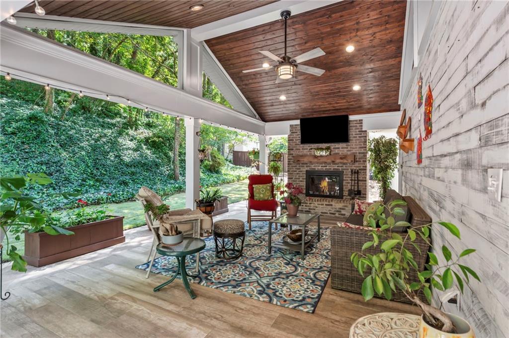 Sophisticated Ranch in Brookfield Country Club!! This beautifully renovated open-concept ranch combines modern elegance with effortless livability. Bathed in natural light, the home boasts 4 bedrooms, 3.5 designer bathrooms, and exquisite hardwood floors throughout. The gourmet kitchen is a true showpiece with an oversized granite island seating 4+, premium stainless steel appliances, beverage fridge, and Medallion soft-close cabinetry with dovetail finishes and endless pull-out storage. Entertain with ease in the sun-filled great room, unwind in the expansive sunroom, or host unforgettable evenings in the covered outdoor living space with fireplace. The private, level backyard with fresh new zoysia grass completes this ideal retreat. Perfectly positioned in highly sought-after Brookfield Country Club, and located just minutes from fine dining and boutique shopping on Canton Street in downtown Roswell, as well as top-rated schools including Roswell High, Crabapple Middle, Blessed Trinity, Queen of Angels, Fellowship Christian, and Mountain Park Elementary, this unique property offers refined style, elegance and premier location. Convenient to show, schedule your tour today!