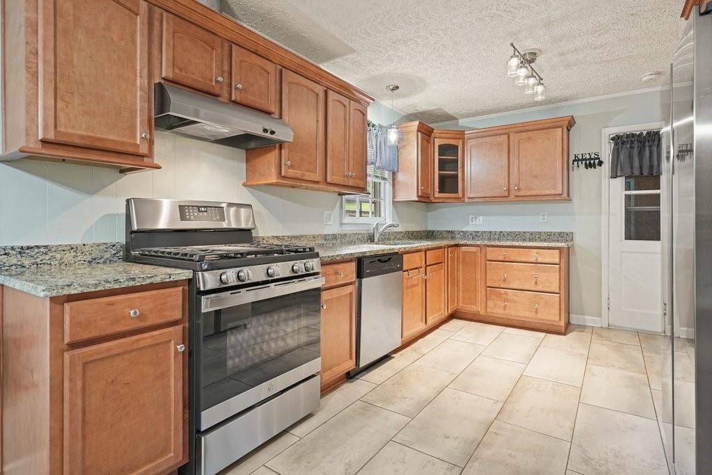 You won't want to miss this one! This immaculate, 4 sided brick ranch is situated on a corner lot with .35 of an acre in the golf cart zone! Meticulously maintained & loved with tons of upgrades. Gleaming hardwood floors, updated kitchen with granite countertops, stainless steel appliances, beautiful stained cabinets and new tile flooring. Large hall bathroom is beautifully updated with a walk-in shower and tile flooring. Roof is only 3 years old, HVAC is one year old and crawl space is even climate controlled. The yard is landscaped and newly fenced with a newer shed for a great workshop or storage building. Extra parking area would allow room for a boat or RV. The location is ideal as you are just a short golf cart ride away from Historic Downtown Acworth with all of our award winning restaurants, shopping, parks, trails and lakes.