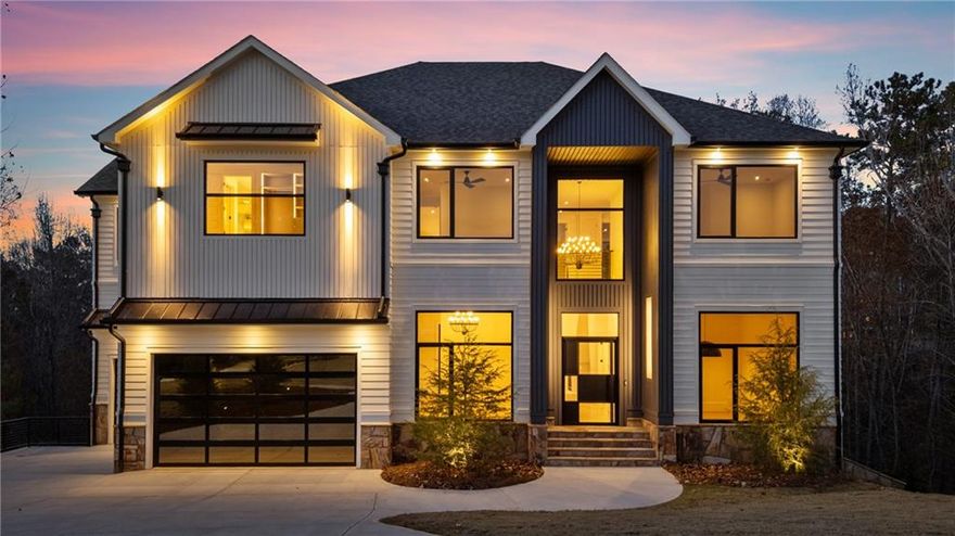 Experience modern luxury at 520 Heathmill Court, a contemporary home tucked in a quiet Milton location. Designed for both everyday living and entertaining, the open layout features a sleek kitchen with custom cabinetry, a stone waterfall island, full-height stone backsplash, premium appliances, and a wood-wrapped hood. The kitchen opens to a spacious great room with a plaster fireplace and oversized sliders leading to a covered patio and private wooded backyard.

The main level includes a guest suite, dedicated office, glass wine display, and wide-plank hardwood floors. Upstairs, the primary suite offers a relaxing retreat with abundant natural light, a double-sided fireplace, and a spa-like bath with frameless glass shower, dual vanities, and a large walk-in closet. Additional bedrooms are bright and well-appointed.

Set on a quiet, tree-lined street, this home offers a rare blend of modern design, privacy, and convenience close to Milton and Alpharetta amenities.