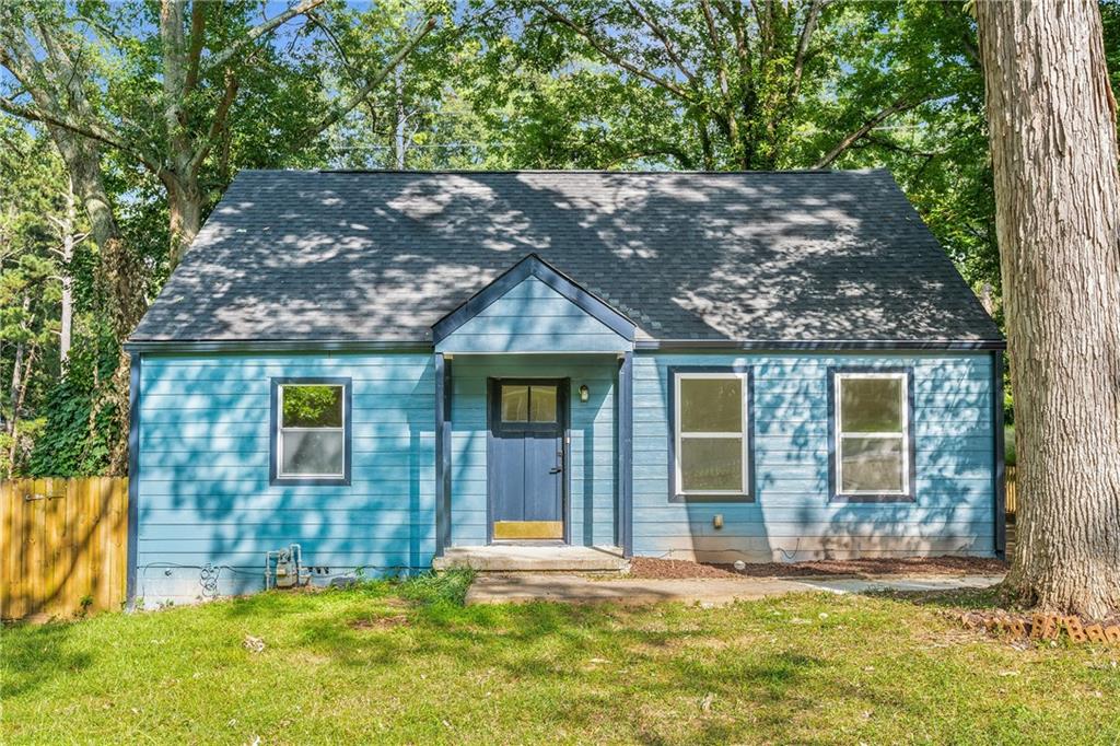 This beautifully renovated 3 bedroom, 2 bathroom home offers a perfect blend of style, comfort, and convenience. Step inside to find a thoughtfully redesigned interior featuring brand-new flooring, fresh paint inside and out, recessed lighting, new windows, a new roof, and more. The spacious living room flows seamlessly through charming arched entryways into the renovated kitchen, complete with sleek white countertops, crisp white cabinetry, and new fixtures. French doors off the kitchen open to a large deck overlooking an expansive backyard ideal for entertaining, pets, or simply enjoying the outdoors.
The home’s layout boasts a private primary suite upstairs, creating a true retreat with its fully updated ensuite bathroom. Both bathrooms shine with new
flooring, custom tilework, modern vanities, and stylish fixtures. Outside, the curb appeal shines with a charming front yard fence, ample driveway parking,
and a brand-new portico entryway that adds character and warmth. Located just minutes from Tyler Perry Studios, Downtown East Point, and
Hartsfield-Jackson Airport, this home offers not only modern comfort but also unbeatable access to the best of Atlanta living. Several photos in this listing are virtually staged.