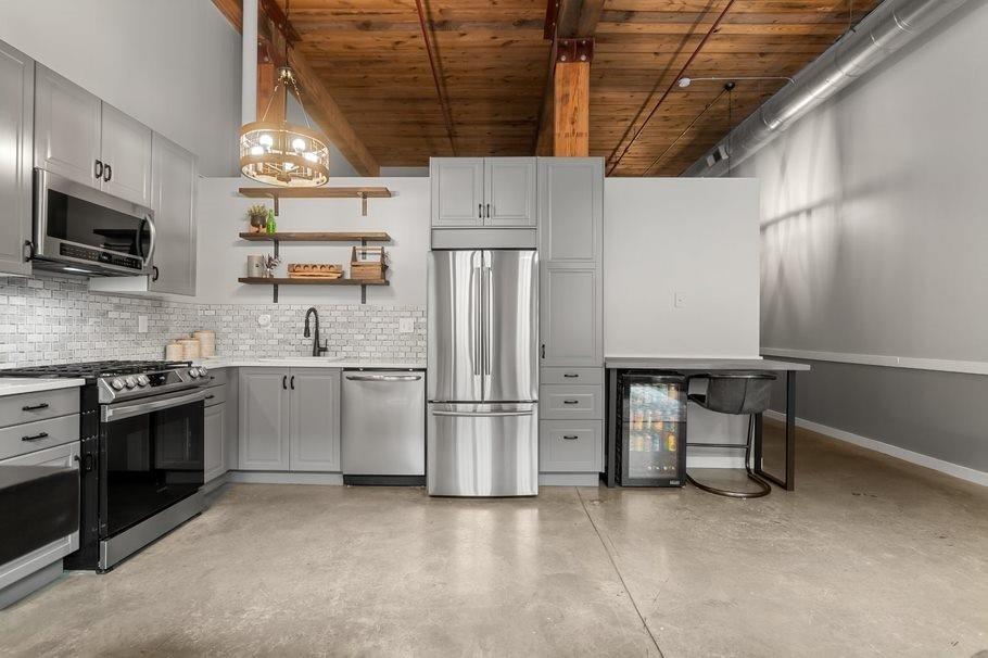Beautifully renovated historic and charming loft in the heart of Cabbagetown. Spacious open floor plan with modern industrial design. Columns and exposed beams and bricks, concrete polished floors and soaring ceilings. Gorgeous kitchen with quartz countertops and newer stainless appliances and backsplash. Large living room and entertaining area. Bedroom with updated barn door and walk in closet Gorgeous bathroom. Full laundry room with storage. Large palladium full windows with lots of natural light. Newer water heater. So many incredible amenities including a pool, fitness center, 24 hour security gate, rooftop deck with incredible views, grilling area, dog park and so much more. Walking distance to the Beltline, Krog Street Market, MLK Marta Station, Fetch dog park and restaurants. Incredible neighborhood.