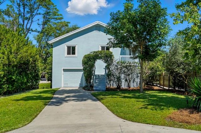 This move-in ready home offers a thoughtful blend of modern features and classic charm. Inside, you'll find beautiful hardwood floors that bring a warm, natural feel to the space. The open-concept layout connects the kitchen and living room, making it a comfortable setting for everyday life or casual gatherings. The kitchen includes stainless steel appliances and opens directly to the living area, where vaulted ceilings, a large ceiling fan, and a fireplace create a spacious yet cozy atmosphere. The bathroom is generously sized with double vanity sinks, offering both function and style. A one-car garage adds extra storage and convenience. With its clean design and inviting details, this home is ready for its next owner.