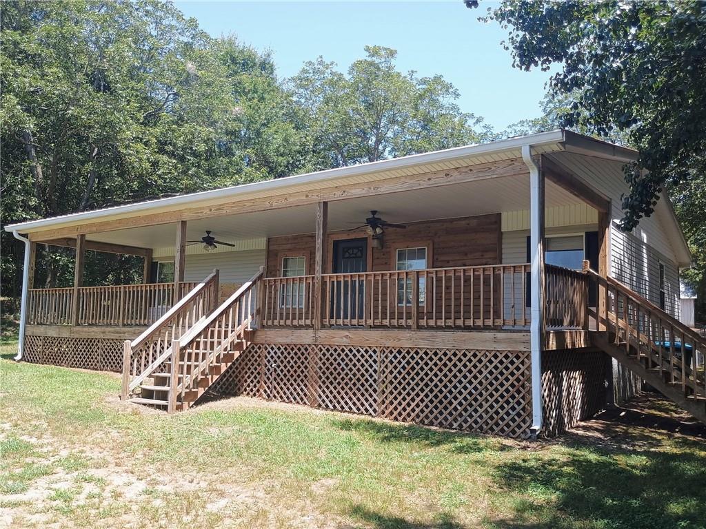 Terrific price improvement!! Affordable and hard to find qualities can describe this property. Buyers wanting their privacy, opportunities to create a great life with places to raise the kids. Come to garden, build your coops, spend your evenings listening to the quiet and crickets! This home has been remodeled in many rooms, including a new water heater, AC recently serviced, New LVP in both bathrooms, freshly painted, decks are sealed and wood repairs done, New shutters, A buyer will have peace of mind knowing that repairs and work have been done to make this a great place to call home! With 2 big metal barns/shops, Two acres, Perimeter fenced and some cross fencing. Entire outside including roof pressure washed! Ready for your family to enjoy. Call for information.