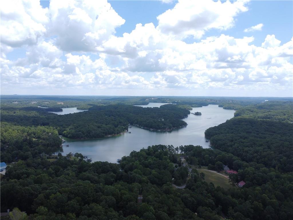 This residential lot offers stunning views of Lake Lanier and is located within a prestigious gated community, providing both privacy and security. Nestled among mature trees and gently rolling terrain, the lot presents an ideal setting for building a custom home that takes full advantage of the lake scenery.
Residents enjoy exclusive access to a community courtesy dock. The neighborhood is well-maintained, with paved roads, underground utilities, and attractive homes that enhance the overall appeal of the area.
Whether you’re looking for a peaceful retreat or a vibrant lakeside lifestyle, this property offers a rare opportunity to build your dream home in a desirable Lake Lanier setting.