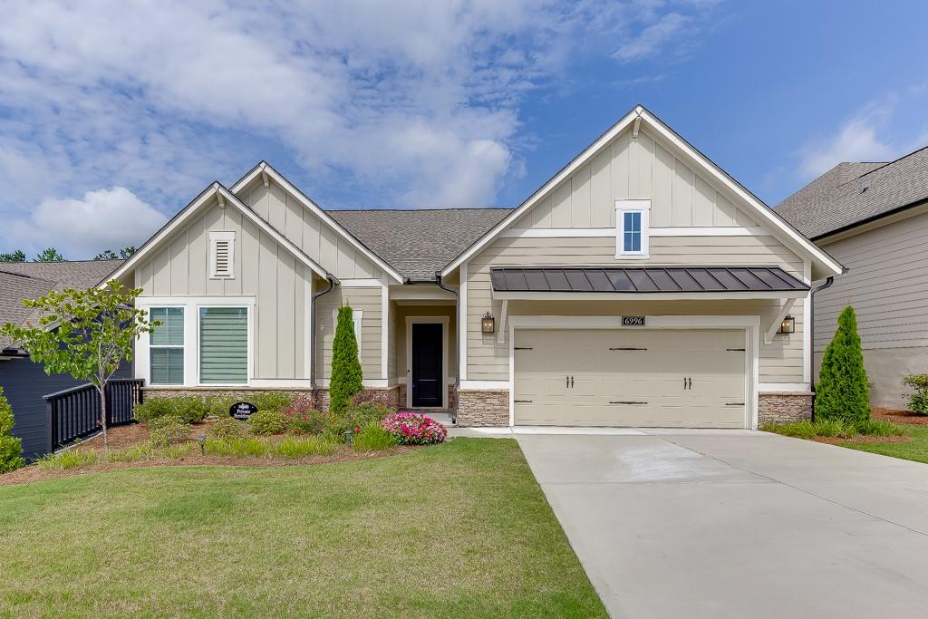 Nestled in the desirable Retreat at Sterling on the Lake, an active adult community, this beautifully designed 3-bedroom, 3.5-bath ranch home offers comfort, style, and an exceptional lifestyle. The inviting floor plan features a spacious eat-in kitchen with white cabinetry, a large kitchen island, breakfast bar, solid surface countertops, a walk-in pantry, and a seamless view into the family room, making it the heart of the home for gatherings and everyday living. The master suite is peaceful retreat with an elegant ensuite bathroom complete with a double vanity, a beautifully tiled shower, and a generous walk-in closet. Each of the two additional bedrooms includes its own private bath, ideal for guests or multi-generational living. This home also features a two-car garage and a level yard that backs to a serene tree line, offering both privacy and natural beauty. The gated community enhances your lifestyle with amenities that include a clubhouse, fitness center, swimming pool, tennis and pickleball courts, playground, fishing lake, and scenic walking trails. Conveniently located near shopping, schools, and everyday essentials, this home combines comfort and community in one perfect package.