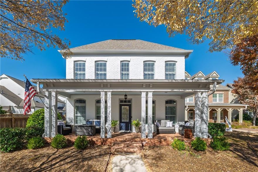 This thoughtfully designed home boasts an inviting, open-concept layout. Step inside to find soaring 10' ceilings on the main floor, where the dining room with elegant wainscoting flows into an open-plan living room complete with a gas fireplace, custom bookcases and large windows fitted with plantation shutters. The kitchen features a large island, a breakfast nook/keeping room, a walk-in pantry, and modern appliances.
The main level also has a secluded primary suite, complete with a spa-like bathroom that includes a separate shower and tub, a double vanity, and a generous walk-in closet. Upstairs, the space offers a roomy secondary living area, a guest suite with an en-suite bathroom and walk-in closet, two additional bedrooms, and a second full bathroom. Storage is abundant thanks to ample closets and a sizeable two-car garage with custom overhead storage. The private, fenced backyard features professionally maintained turf that remains evergreen throughout the year, along with a back patio for outdoor grilling and dining. The HOA is responsible for yard upkeep. Community amenities feature a community pool, clubhouse, two parks, a playground, and a dog park. Crabapple Crossroads is a sought after live walk community just 15 minutes from GA 400 and 10 minutes from downtown Alpharetta and Avalon. This classic yet stylish Milton home is conveniently located near shops, restaurants, and top-rated schools. Do not miss out on the opportunity to tour and see one of the few primary suite floorplans in the community.