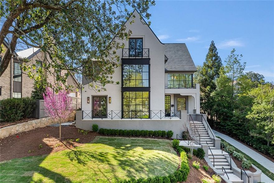 A Masterpiece of Modern Craftsmanship Overlooking Ansley Park’s Finest Green Spaces Welcome to a newly completed architectural triumph, impeccably designed and built by Ladisic Fine Homes in collaboration with architect Linda MacArthur. Nestled in coveted Ansley Park with sweeping views of The Dell and Winn Park, this residence is a rare blend of refined style, modern functionality, and timeless craftsmanship.  Step inside and be greeted by soaring ceilings, an open layout, and expansive steel-framed windows and doors that flood the interiors with natural light, creating an atmosphere of warmth and sophistication. The main level offers seamless flow between the kitchen, family room, and stunning walk-out backyard—an entertainer’s dream. Gather in the oak-paneled library, where French doors open to a serene patio, or enjoy the warmth of multiple fireplaces, each with meticulously crafted surrounds.  With four finished levels, the home provides abundant space for both quiet retreat and vibrant entertaining. The primary suite is a true sanctuary, featuring a bank of steel windows, a spacious, spa-like bath with luxurious finishes, a serene atmosphere, and thoughtful design details. Two additional ensuite bedrooms, a spacious laundry room, and a flexible office or media space complete the second floor.  The third level offers a unique bonus space with a rooftop terrace showcasing breathtaking skyline views, a wet bar, and an additional bedroom and full bath—perfect for guests or a private retreat. The lower level expands the home’s functionality with a large wine cellar, mudroom, and ample storage.  Outside, the private backyard is your personal oasis. Lounge by the saltwater pool, dine al fresco on the patio, or retreat to the three-car garage’s finished upper space with its own full bath, perfect for a studio or guest suite.  Situated just blocks from the Atlanta Beltline, Colony Square’s cultural and dining destinations, and some of the city’s best entertainment, this home offers the pinnacle of Ansley Park living. *The fifth bedroom and full bath noted in the lower level are in the carriage house.