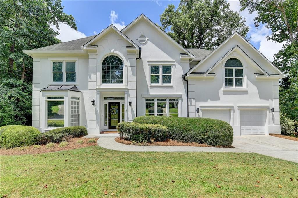 Beautifully updated home with fresh interior and exterior paint, New Luxury flooring, and New stainless steel appliances. Spacious finished basement includes a media room and a mirrored flex space—ideal for a home gym, yoga, or barre. Butler’s pantry with wine storage adds convenience and charm. Located minutes from GA-400, Avalon, Downtown Alpharetta, Park,and North Point Mall. Zoned for top-rated Johns Creek High School and near excellent public and private schools.