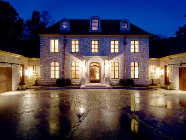 Total reduction of over $1,500,000!! Graceful charm and Old World elegance define this exceptional residence which was inspired by the natural elements and pure comforts of the French countryside. Superior to all new homes in this price range. You will fall in love with the antique mantels, timbered ceilings, French range and all the details you can imagine.