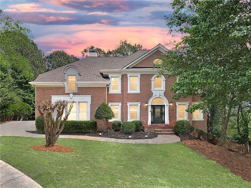WOW! This is the one you’ve been waiting for! You will love this stately 6 bed, 5 bath, 4-sided brick, move-in ready traditional home with loads of natural daylight, guest suite on the main level, updates throughout, full finished daylight terrace level and more, all situated on a quiet cul-de-sac in the highly sought-after Alpharetta/Johns Creek swim/tennis community of Chartwell! The spacious main living level offers a formal living room, formal dining room, large guest bedroom, updated full bathroom, laundry room with utility sink, and the fabulous updated kitchen complete with quartz countertops, stainless appliances, double oven, pantry, and adjacent breakfast area open to the striking vaulted fireside family room, all overlooking the peaceful, private tree-lined backyard! Upstairs, you’ll find three spacious guest bedrooms, two guest bathrooms, and the oversized retreat-like primary suite with trey ceiling detail, fireplace, and the renovated spa-like ensuite bath featuring a double vanity, walk-in shower, and separate centerpiece soaking tub! The full, finished daylight walk-out terrace level includes an additional family room, media room, bonus space, guest bedroom, and full guest bathroom! This home offers plenty of opportunity for outdoor entertaining with an expansive, low-maintenance Trex deck on the main living level, and a green space for additional activities! Driveway parking pad provides space for multiple cars or basketball play. Chartwell community includes pool, tennis courts, clubhouse, playground, and a community lake, and is located just steps to Newtown Park, shopping, restaurants, and more! Easy access to GA 400! DON’T WAIT, be sure to schedule your showings ASAP!