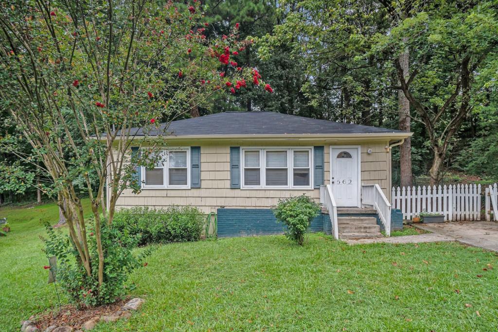 Charming Cottage Living with Easy Access to Marietta Square! Tucked in a prime Marietta location, this delightful 2-bedroom, 1-bathroom cottage is full of warmth, character, and everyday convenience. With easy access to Marietta Square, Kennestone Hospital, and the local Shops, Restaurants, and Parks that give the neighborhood its charm, this home offers the ideal blend of lifestyle and location. Inside, you'll find beautiful Oak Hardwood Floors, Crown Molding, and a sun-drenched living room that creates an inviting first impression. The Open-Concept Living and Dining Area flows seamlessly perfect for everyday living or entertaining guests. Two Spacious Bedrooms offer flexible options for a Home Office or visitors, with a Shared Full bathroom. Step outside to your Private Backyard retreat complete with a Deck ideal for outdoor dining and a fully fenced yard with room to garden, play, or unwind. All just minutes from I-75, Truist Park, and everything Marietta has to offer. Don't miss your chance to own this charming gem in one of Cobb County's most convenient locations! Seller is motivated and offering a 1-year Home Warranty - we'd love to work with you!