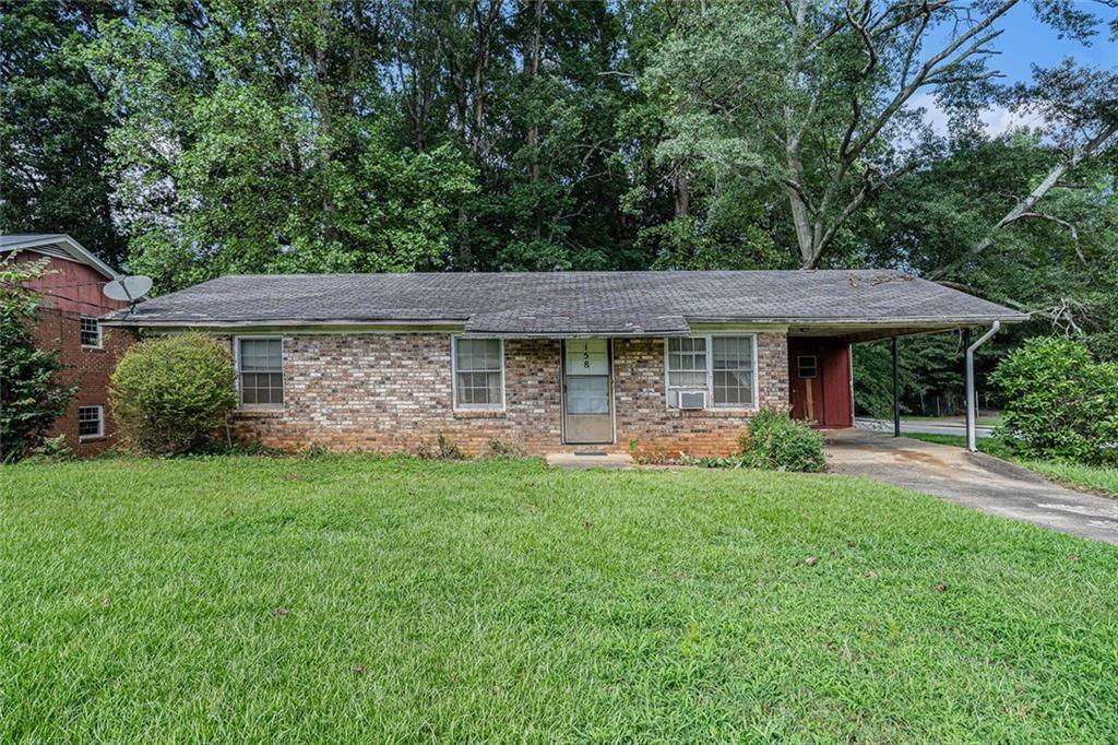 DRASTIC PRICE REDUCTION! 3 bedroom, 1.5 bathroom, brick-front fixer-upper on a large corner lot in a NON HOA community is perfect for your next project! This one-level home on a walkable crawl space offers plenty of storage and great potential to create your masterpiece. Enjoy a spacious front and backyard along with the screened-in porch that is perfect for relaxing. If convenience is top of your list, this conveniently located home is across from Garwood Athletic Complex and near I-85, dining, family entertainment, event centers, a water park, library, and a local community college. With the right vision, this home can shine—don’t miss this opportunity! Schedule a showing today. As-Is.