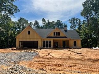 You're gonna want to call this place home!! Stunning 3/2 one level ranch with flex space on 2.70 ACRES! This plan features split bedrooms which offers privacy for the owner's suite complete with trey ceiling, private bath with tile shower, soaking tub, huge walk in closet and double vanities. This home has all the space and charm you've been looking for, open concept perfect for entertaining and everyday living. Enjoy the beautiful nature surrounding you while you sit on your covered front porch or rear porch and patio. Single road development with only 7 private estate lots. Builder has spared no upgrades, granite, LVP flooring in all main living areas, tile wet areas, true vent hood, stainless steel appliances, black double paned insulated glass windows, hardiplank concrete siding, quiet run garage door, too many to list. Listing agent is the wife of the builder/seller