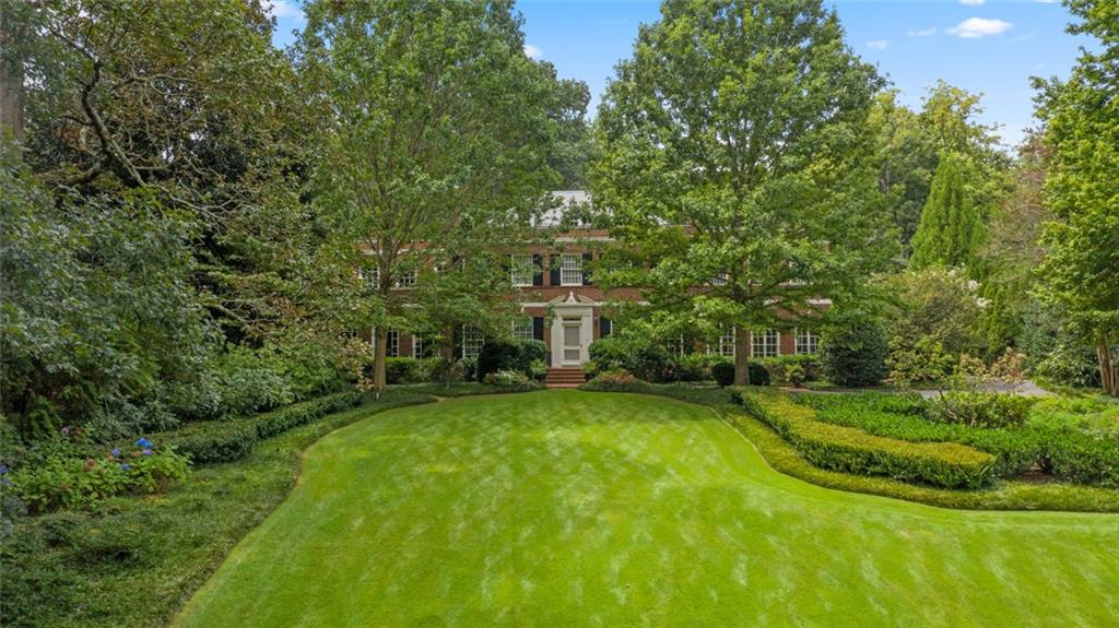 This stately home has unmatched curb appeal set atop a perfect knoll in the Haynes Manor neighborhood. Designed by Cooper and Cooper in 1930, the home highlights views of what is undoubtedly one of the best and largest lots in the neighborhood. Beautifully maintained and recently updated, this estate-sized property features a gracious front lawn, guest motor court, exquisite landscaping, and a gated family motor court. Extensive limestone terraces surround the pool and pavilion. Beyond the pavilion is an open flat lawn that is very generously sized as a playing field. The home is both comfortable and sophisticated, with tall ceilings and an impressive two-story entertainment room which provides a grand space to gather. The bright and airy kitchen was completely renovated by Design Galleria in 2015. Above the garage is a first-class nanny/guest suite, while the other 4 bedroom / bath suites are on the 2nd floor. This very special home is one that comes around only once in a generation!
