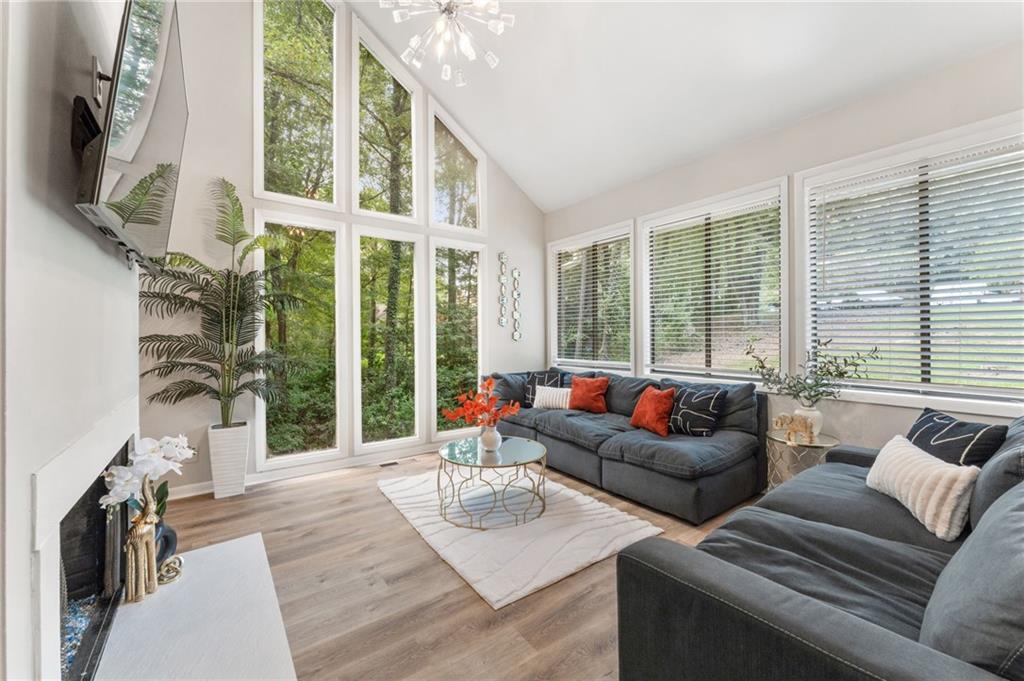 Discover this beautifully updated contemporary home in the highly desirable Willow Point, Walton High School district. The master bedroom is conveniently located on the main floor, while the upstairs features secondary bedrooms, creating a perfect kid-friendly space. The expansive main-level deck spans the entire length of the house, with access from the dining room, kitchen, and master bedroom. Additional highlights include an oversized two-car garage, a roof less than four years old, a water heater less than three years old, stainless-steel appliances, and new LVP flooring throughout. Nestled in a quiet cul-de-sac with extra parking available, this home is just minutes from Roswell, Chattahoochee National Park, hiking trails, shopping, and more. Be sure to check out the community amenities at 5361 Willow Point Pkwy, which include an active swim/tennis area, a playground, basketball courts, and plenty of social events for everyone to enjoy. This home is a must-see!