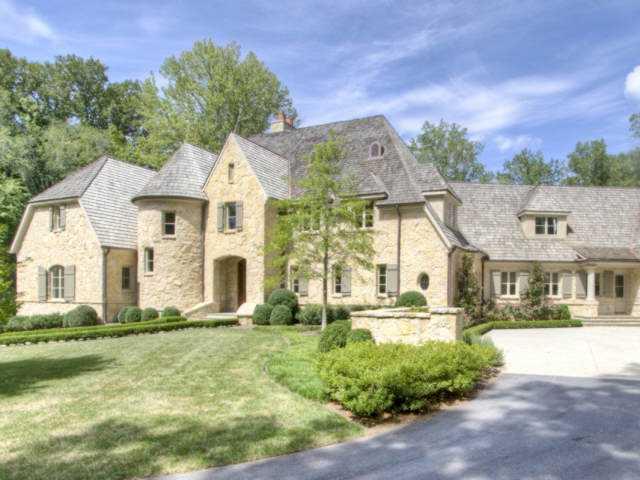 Custom French Manor by YM Derazi. Built with beautiful field stone, cedar shake roof, & copper gutters. Four car garage, wine cellar, media room, pool, spa and elevator.