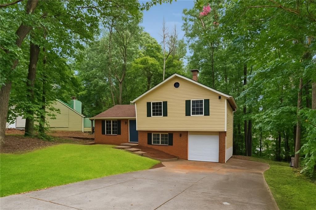 Discover your ideal home at 1984 Singer Way, Lithonia, GA 30058, a charming residence nestled in a sought-after neighborhood. This inviting home boasts a fresh and modern interior with newly painted walls, creating a bright and welcoming atmosphere. Situated on a spacious corner lot, the property offers excellent curb appeal and ample outdoor space. Step outside to the relaxing rear deck, perfect for hosting gatherings or enjoying quiet evenings. The home features a convenient garage, complete with a brand-new door and opener for secure and easy access. Inside, a versatile space awaits, ideal for use as a cozy sitting area or a productive home office, highlighted by a warm brick fireplace that adds character and charm. Stay comfortable year-round with a new exterior HVAC unit. Don’t miss the chance to own this beautifully updated home, blending style, comfort, and functionality in a prime Lithonia location. Schedule a showing today to experience all that 1984 Singer Way has to offer!