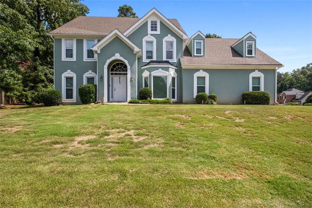 Nestled in the serene and amenity-rich Rivershyre swim & tennis community, this stately traditional home offers both elegance and comfort. With 4 bedrooms, 2 full bathrooms, and 1 half-bath spread across a spacious 2,875 sq ft, it's the perfect canvas for whatever your lifestyle demands. Step inside a dramatic two-story foyer that sets the tone for refined living. The thoughtfully updated chef’s kitchen boasts quartz countertops, a cozy breakfast bar, and pristine white cabinetry—overlooking the living room with its inviting masonry fireplace. Whether you're entertaining, working from home, or enjoying family life, this property offers flexibility and charm in a sought-after Lawrenceville neighborhood.
