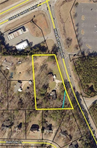Potential Commercial Property – approximately 2.1 acres of land currently zoned R3-Residential with 200’ of road frontage off Hiram Acworth Hwy (Hwy 92) in Dallas, GA. This property is off the Charles Hardy Pkwy (GA 120) and Hiram Acworth (Hwy 92) intersection and has wonderful potential for many business applications. It is directly across the street from the Stars and Strikes Family Entertainment Complex. Excellent location with good traffic count at approximately 15K/day, according to the most recent data available through GDOT. There are two existing residential buildings on it, one being a 3/2 bath ranch and another 3/2 mobile home on permanent foundation. A GDOT road widening project is planned and will take approximately .3 acres of road frontage for widening project. Great time to plan for business entrance and exit plans in conjunction with GDOT project. If you or your client need more space, this property could be assembled up to a total of approx. (7.4) acres, with the purchase of the three additional properties located directly behind this parcel (see overhead picture in photos). Acquisition of all parcels would allow road frontage on both Charles Hardy Pkwy and Hwy 92.