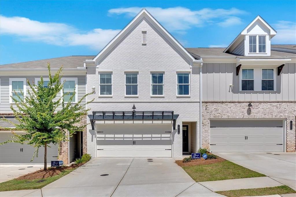 Experience the perfect blend of elegance and modern comfort in this beautifully designed townhome. Just two years old and impeccably maintained, this home surpasses new construction with its designer touches throughout. Step into a bright, open-concept living space featuring gleaming hardwood floors, recessed lighting, and contemporary finishes. The gourmet kitchen boasts crisp white cabinetry, granite countertops, and stainless steel appliances-ideal for both everyday living and entertaining. Upstairs, relax in the spacious primary suite with ample natural light. A versatile office nook and well-appointed secondary bedrooms offer flexibility for work or guests. Every detail has been thoughtfully curated to create a sophisticated, move-in-ready home. Short Sale - subject to 3rd party approval.