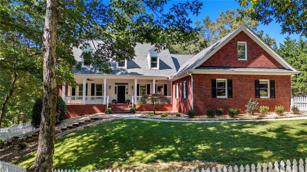 Executive Estate Living: 6,700 Sq Ft of Renovated Luxury on a Secluded 9.99 -Acre Lot.
Welcome to your completely private sanctuary. This custom-built, 5-bedroom, 4-bath residence spans over 6,700 square feet of meticulously updated living space on nearly 10 magnificent acres. With over $100,000 invested in recent renovations, this home has been thoughtfully transformed and is ready for its next owner.
Every detail shines: The interiors feature fresh, contemporary paint, beautifully refinished floors on the main and basement, and brand new luxury vinyl plank flooring upstairs. The heart of the home is the gourmet kitchen, which boasts upgraded appliances, brand-new countertops and backsplash, and freshly painted cabinets. Enjoy the ease of a spacious main-level primary suite.
The home is designed for seamless entertaining. Open-concept living areas flow perfectly for gatherings, while the fully finished walkout basement provides endless possibilities. Complete with a wet bar, this flexible space is ideal for a dedicated game room, a luxurious home theater, or a private in-law suite.
Outdoor life is enhanced by a durable, newly built Trex deck (2024), a covered lower-level patio, and a drive-around entrance. The detached 4-bay garage has been updated with fresh paint and an epoxy floor, creating an ideal workshop or storage area for vehicles and equipment. An updated roof (2021) and professional landscaping complete this stunning package. All this, located just moments from GA 400 access, fine dining, and shopping. This is the ultimate blend of privacy, luxury, and location.