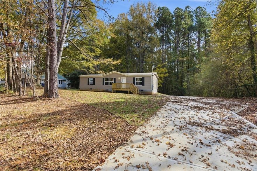 This stunning 3-bedroom, 2-bath home is truly move-in ready and waiting for you to make it your own! Perfectly situated on nearly an acre of land, it offers 1,264 square feet of open, comfortable living space designed for both relaxation and entertaining. Step inside to discover a bright and inviting interior where every detail has been thoughtfully updated. Everything is brand new—including the roof, HVAC system, appliances, flooring, lighting, and fixtures—giving you the peace of mind that comes with worry-free, modern living from day one.

The open-concept floor plan effortlessly connects the spacious living area, dining space, and kitchen, creating a warm and welcoming atmosphere for gatherings with family and friends. The kitchen is the true heart of the home, featuring a large island with plenty of seating, sleek new appliances, and ample storage—perfect for cooking, entertaining, or simply enjoying your morning coffee.

The split-bedroom layout provides added privacy, with the primary suite tucked away for a quiet retreat. You’ll love the generous walk-in closet and the beautifully appointed ensuite bath, complete with modern finishes and a sense of everyday luxury. The additional bedrooms are well-sized and versatile, ideal for family, guests, or a home office.

Outside, you’ll find a peaceful, nearly acre-sized lot offering endless possibilities—create a garden, add a workshop, or simply enjoy the extra space and privacy. With clean lines, fresh finishes, and a serene setting, this home blends comfort, convenience, and style in one perfect package. Whether you’re a first-time buyer or looking to downsize into something brand new, this home is ready to welcome you.
