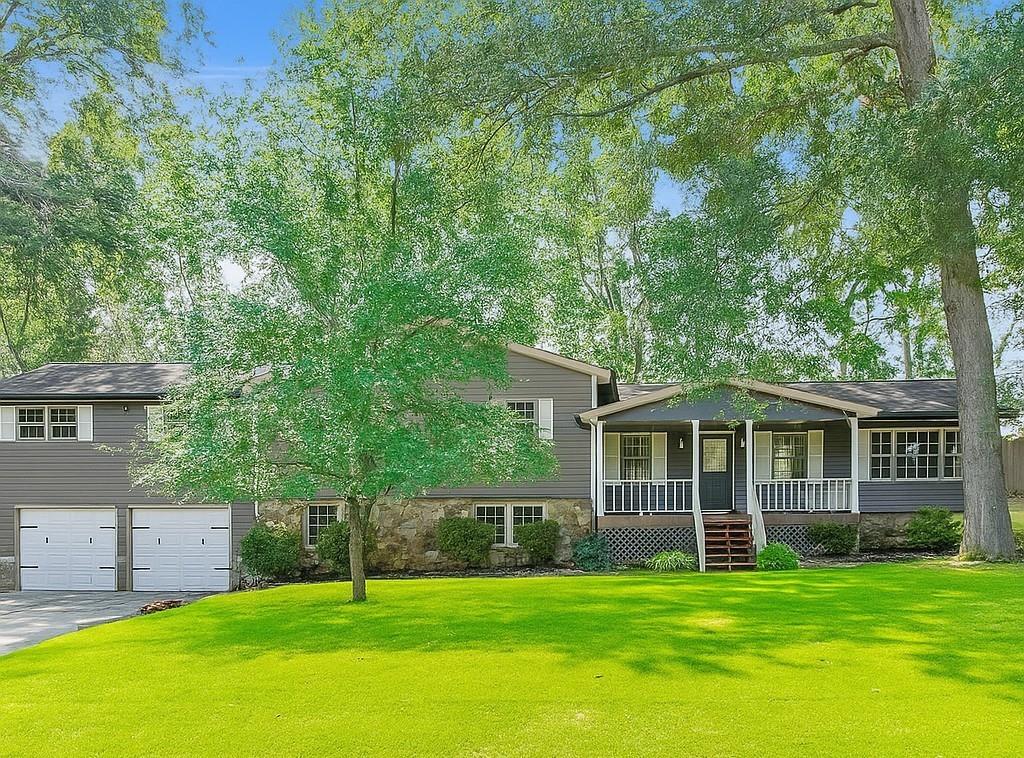 SELLER IS MOTIVATED!!!! ****USE ADDRESS 942 OLD BATESVILLE RD**** No HOA! Tucked away on a quiet dead-end street in sought-after Hickory Flat, this beautifully renovated 4BR/3.5BA home blends charm, privacy, and convenience—just 7 mins to Alpharetta and 4.5 miles to downtown Woodstock. Inside, enjoy a spacious layout with two master suites, a fully updated kitchen, spa-like bathrooms, and a finished walk-out basement with private entry, kitchenette, and bonus room. Relax on the covered porch or entertain on the large back deck. Exterior perks include a double garage with rear access, a wired outbuilding, and RV/boat parking. Major updates: new HVAC, roof (2018), encapsulated crawlspace, 220V electric, and more. Rare opportunity—schedule your showing today!