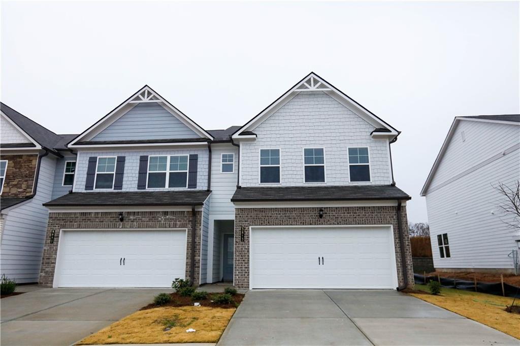 WELCOME HOME!! Spacious BRAND NEW Townhome for Rent with 3 Bedrooms/2.5 Baths. End unit. Bright, open floorplan with gleaming Hardwood floors throughout main level. Open concept Dining area leads into a Large Family room with a corner Fireplace. Luxurious eat-in Kitchen with White cabinets, Granite countertops, Tile backsplash, a Large center Island, Stainless steel appliances, and Pantry. Oversized Master Suite upstairs includes an ensuite with Double vanities, a separate Shower & soaking tub, and a BIG walk-in closet. Two large secondary bedrooms upstairs each with a walk-in closet. The secondary bathroom even has Double vanities! LARGE, open Loft space available upstairs. Private backyard. New community in Gainesville. Conveniently located near schools, shopping, restaurants and more! Don't wait!! This won't last long! Lawn maintenance included in Rent. Minimum credit score 650. Income 3x rent amount. **New Refrigerator will be installed prior to move-in**