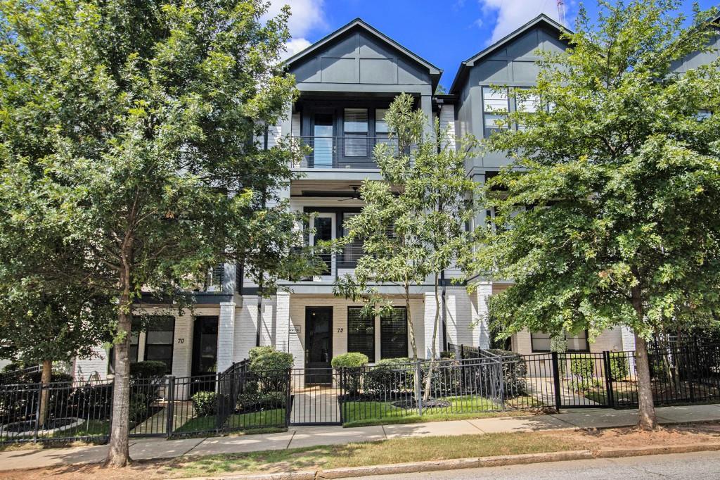 Modern Living in the Heart of Kirkwood! Welcome to this stunning Three-Level Townhome, perfectly positioned in one of Atlanta's most exciting neighborhoods. Just across from Pullman Yards and Walkable to Downtown Kirkwood, the BeltLine, and neighborhood favorites like Elmyriachi and Evergreen Butcher & Baker, this home puts you right in the center of it all. Step inside and discover a thoughtful layout designed for both comfort and style. The Entry-Level offers a versatile Bedroom with its own Full Bath ideal as a private Guest Suite, Home Office, or creative studio. The Second Floor is where life happens. An Open-Concept Plan connects the Living Room, Dining Room, and Kitchen, creating a bright and airy atmosphere that's perfect for gatherings. The Chef's Kitchen boasts a Large Island, Quartz Countertops, Stainless Steel Appliances, Subway Tile Backsplash, and sleek finishes. A Sunlit Living Room, Spacious Dining Area, and stylish Powder Room complete this level, while sliding doors open to a Private Deck an inviting spot to enjoy evening sunsets. Upstairs, the Primary Retreat feels like a getaway all its own. Two Walk-In Closets, a Private Balcony, and a Recently Updated Spa-Worthy Bathroom with an Oversized Tile Shower with Bench, and Dual Vanities make it the ultimate sanctuary. A Secondary Bedroom with its own Ensuite Bath and convenient Laundry Access ensures everyone has their own private space. Every detail has been considered, from Wide-Plank Hardwoods to Covered Outdoor Areas on all three levels. A Two-Car Garage provides easy parking and storage, though with so much just steps away including Dining, Shopping, Parks, and Entertainment you may rarely need to drive. Unlike many townhome communities, Edgehill At Historic Kirkwood offers Ample Visitor Parking, making it easy to host friends and family. With only 23 David Weekley Homes in this boutique community, opportunities here are limited. Don't miss your chance to live in one of Atlanta's Most Vibrant and Historic Neighborhoods.