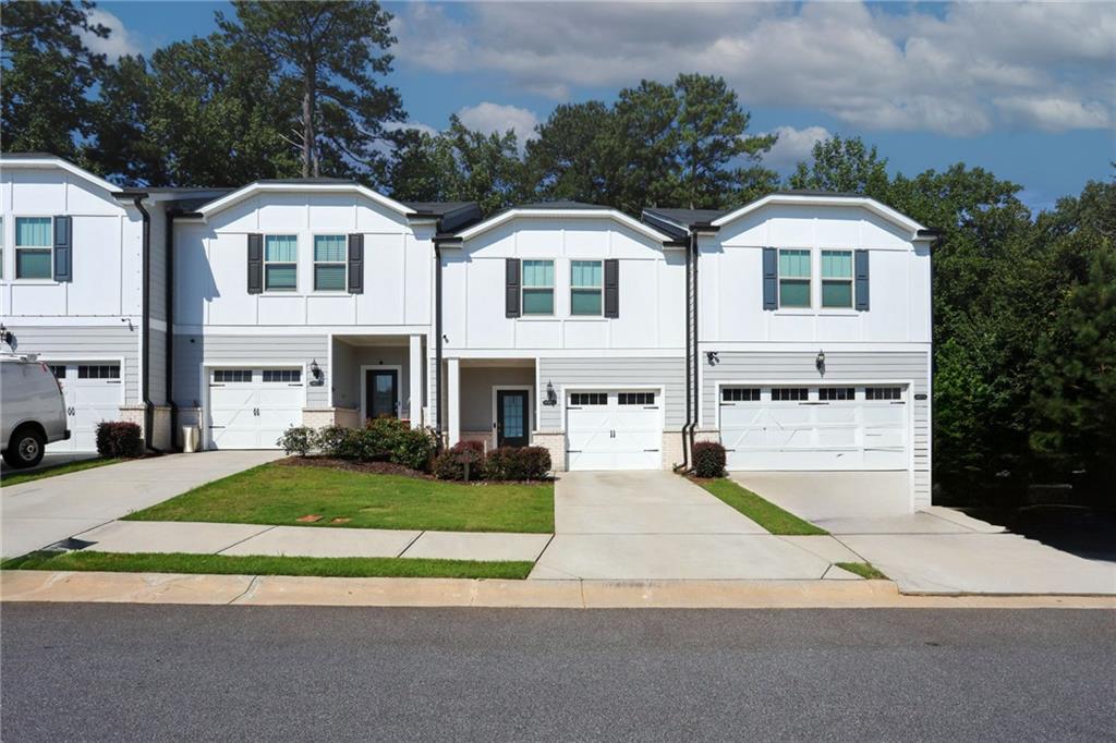 Move-in ready, immaculately maintained Townhouse in a prime Lilburn location. This 3-bedroom, 2.5-bath home features an open living concept with a view of the dining and kitchen areas, complete with a large island seating area, quartz countertops, and a walk-in pantry. Step out onto the private patio overlooking natural green space for a quiet moment. Upstairs is the master suite with a large walk-in closet, dual vanities, a shower stall & linen storage. A spacious loft reading area, well-sized laundry room with additional storage space, and 2 secondary bedrooms with a shared full bathroom. SECTION 8 Voucher is Welcome!