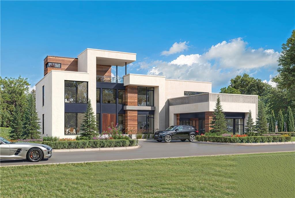 Introducing a rare opportunity to own a refined and modern transitional residence in the prestigious Le Chateau Estates Subdivision of Fairburn, GA, one of South Atlanta's most coveted gated communities, known for its modern European-inspired design and tranquil, natural surroundings. Scheduled for completion in Q1 2026, this striking 3,700 sq/ft modern transitional home is being meticulously crafted by renowned custom builder Boye Akinola of Boye Luxury Homes. Nestled on a pristine private lot, the home embodies the perfect blend of architectural elegance and serene living. Designed by award-winning architect Boye Akinola, the modified Gigi Plan boasts five spacious bedrooms and four and a half bathrooms, offering an ideal blend of style, functionality, and luxury. This thoughtfully curated home features premium finishes and top-tier design selections throughout. Step into an impressive open-concept layout, highlighted by soaring 20-foot ceilings in both the entry foyer and great room. Expansive California-style sliding glass doors create a seamless flow between indoor and outdoor spaces, perfect for both entertaining and everyday living. At the heart of the home lies a chef-inspired kitchen, featuring custom cabinetry, a stunning Quartz waterfall island, a walk-in pantry, and a bright, welcoming breakfast area. The main-level primary suite is a private sanctuary with unobstructed lake views and lush landscape vistas. It includes a generously sized walk-in closet and a spa-inspired bathroom adorned with sleek, contemporary finishes. Complementing the primary suite are three additional bedrooms, each designed with comfort and privacy in mind. All secondary bedrooms on the lower and upper levels feature en-suite bathrooms, making this home ideal for families or guests seeking personal space and convenience. The home's surroundings are equally exquisite, with professionally designed, lush landscaping that enhances privacy while seamlessly blending with the natural lakefront environment. The entire subdivision will feature pristine, manicured grounds, offering residents a heightened sense of exclusivity, comfort, and peaceful living. Additional features include: Energy-efficient insulated modem windows and exterior doors 10-foot ceilings on the main level Wide-plank hardwood flooring in all bedrooms Frameless glass showers Well-appointed laundry room with cabinetry and a wash sink Please Note: Rendered images may reflect optional upgrades, such as accent walls, floating vanities, and a future pool. The addition of a full basement and custom upgrades can be completed at an additional cost. Le Chateau Estates introduces the vibrant sophistication of Miami, Los Angeles, and Lagos to Atlanta, establishing the city's premier and only modern luxury residential community. For more information or to schedule a private consultation, please contact the listing agent.