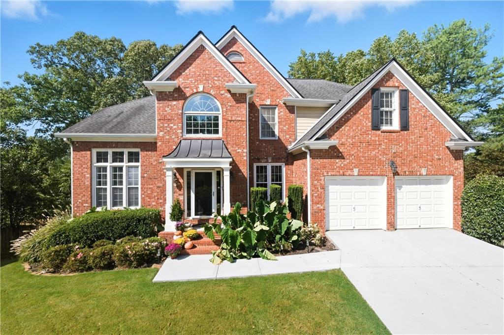 Welcome to this stately 4-bedroom, 4-bath traditional home, recently enhanced with many updates this year, including new white oak, wide-plank floors on the main level, Luxury paint throughout, and all new modern designer fixtures. A grand two-story foyer opens to a formal dining room, a home office with custom built-ins, and a fireside family room that flows into a bright kitchen featuring a new 10 x 4 Carrera marble countertop island, a marble backsplash, stainless steel appliances, and access to a large deck.
The main level offers a guest suite, while upstairs, the oversized primary retreat includes a sitting area, dual walk-in closets, and a spa-like bath. Two bedrooms share a Jack-and-Jill bath, and the upstairs laundry adds convenience.
The finished terrace level provides a second office/craft room, rec room with wet bar, full bath, and walk-out to a covered deck. Outside, enjoy a private backyard oasis with a solar-heated saltwater pool, 15 palm trees, and low-maintenance turf—your year-round retreat at home.
