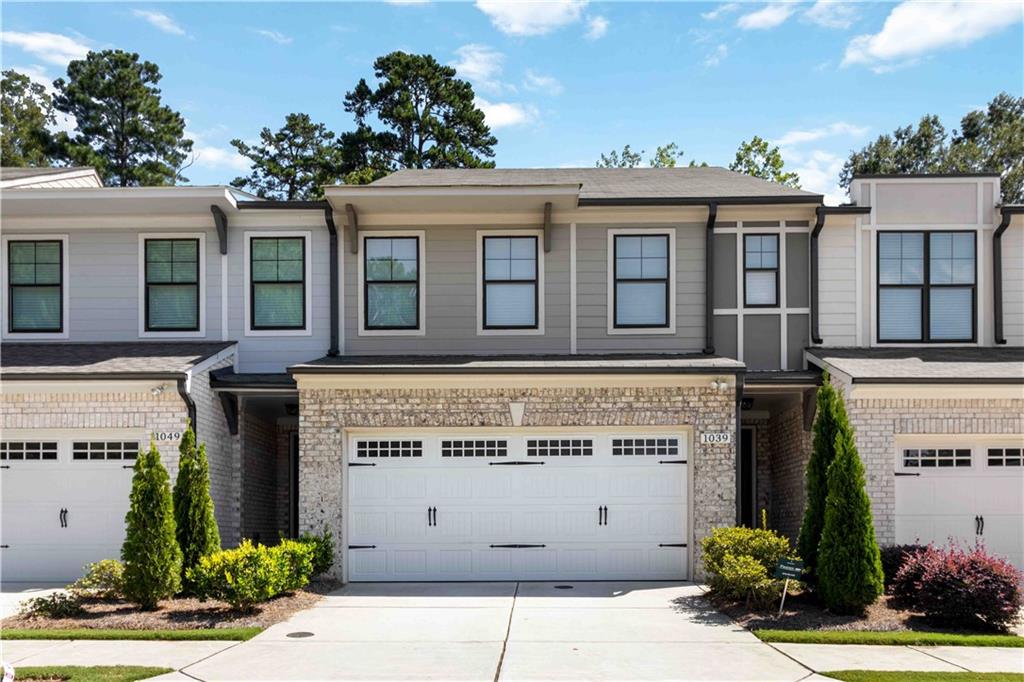 1039 Collections Drive, Lawrenceville, GA 30043 – Step into luxury living at The Collection at Wolf Creek, a gated townhome community in the heart of Lawrenceville. This spacious 2,297 sq ft, 3-story home features 4 bedrooms, 3.5 baths, and an open floor plan filled with natural light. The gourmet kitchen shines with upgraded finishes and overlooks the living and dining areas, perfect for entertaining. Retreat upstairs to a private suite with its own balcony, while secondary bedrooms offer plenty of comfort and space. Enjoy a backyard with a concrete patio, ideal for relaxing outdoors. This smart-home-ready property is equipped with wireless access points and Ethernet throughout, ensuring seamless connectivity. Conveniently located within 5 miles of Hwy 316 and I-85 and zoned to Gwinnett County’s top-rated schools. A rare opportunity to enjoy modern design, smart technology, and gated community living all in one.