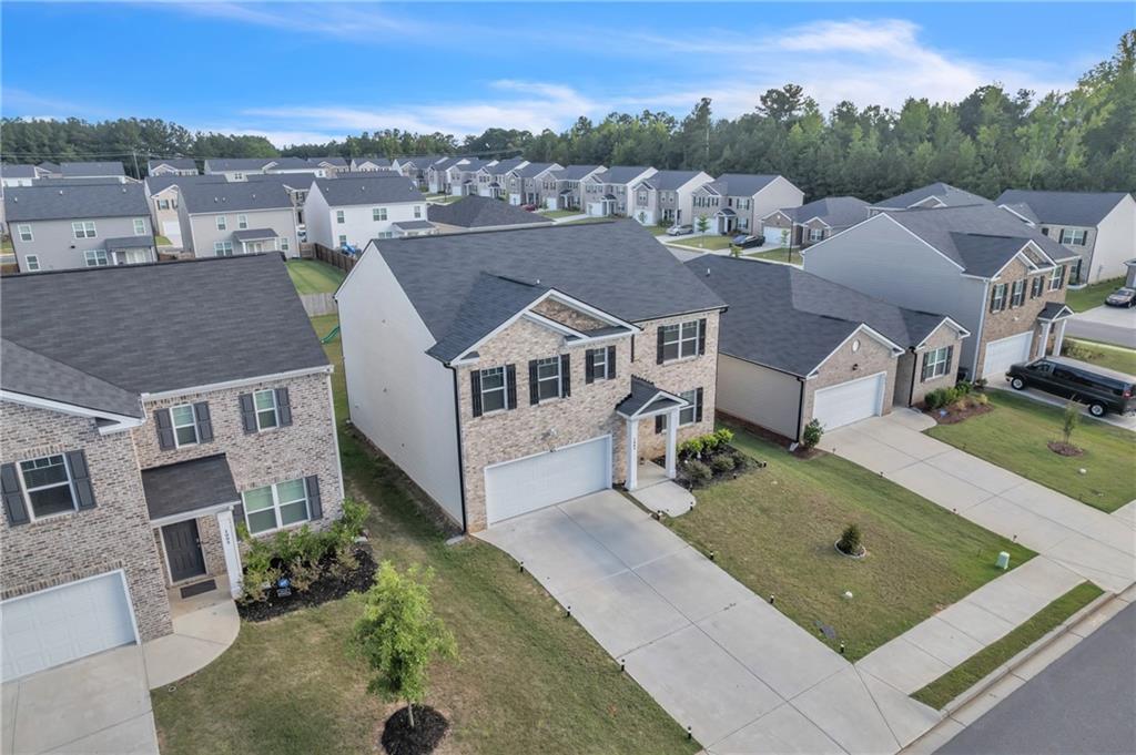 Don't miss this fantastic opportunity to own a beautifully maintained home in the desirable community of Dacula! Nestled at 1985 Waycross Lane, this inviting two-story residence offers the perfect combination of space, functionality, and charm. Step into a bright and welcoming foyer that flows seamlessly into an open-concept living area—ideal for both relaxed living and entertaining. The kitchen features modern appliances, ample cabinetry, and a cozy breakfast nook with views of the backyard, making it the perfect gathering spot for family meals. A versatile flex room on the main level can serve as a formal dining room, home office, or playroom. Upstairs, you’ll find generously sized bedrooms, including a spacious primary suite with a private en-suite bathroom and a walk-in closet. Enjoy the outdoors in your fenced backyard—perfect for weekend barbecues, pets, or play. Located just minutes from top-rated schools, parks, shopping, and dining, with easy access to major highways, this home offers the perfect blend of convenience and suburban tranquility. Whether you're a growing family or a first-time homebuyer, this gem is move-in ready and waiting for you!