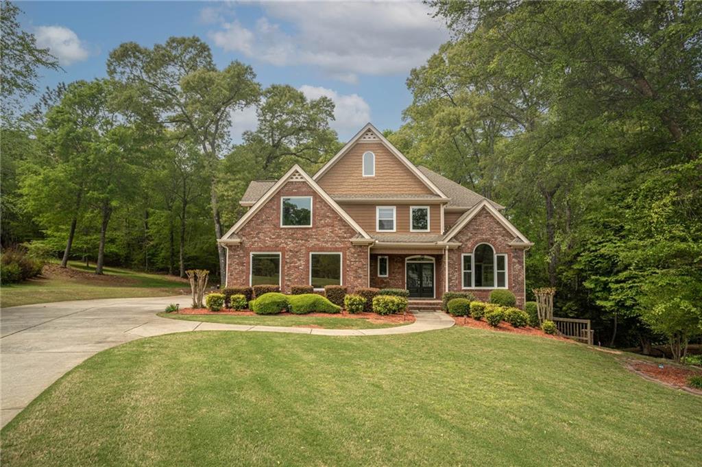 Welcome to this beautifully updated 5-bedroom, 3.5-bath home, perfectly situated in a desirable Walton County community with top-rated Loganville schools. This home offers a modern feel with all-new windows and a newer HVAC system, chefs kitchen has been updated with a large island, perfect for cooking and entertaining. The main-floor primary suite provides convenience and privacy, while upstairs features three spacious bedrooms plus a versatile bonus room. The fully stubbed daylight basement is ready for your personal touch perfect for additional living space, a home gym, or entertainment area. Home is located in a cul de sac so you can enjoy all the privacy, fenced back yard is quiet with a deck off the kitchen which you can enjoy your morning coffee or late evenings outside. Nestled in a well-established neighborhood, this home is a true showstopper. Don't miss your chance to make it yours! Schedule a showing today!