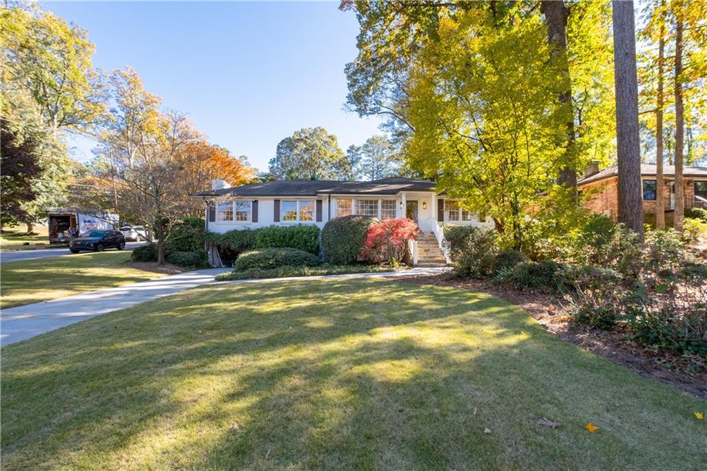 If you're looking for peace, tranquility, and one level living at its finest, then look no further! Did I mention,it's also, in DECATUR?!! This gorgeous, renovated and expanded ranch on a premium flat, corner lot has a pool, plenty of space to play, and a knockout kitchen expansion, primary suite addition, new windows, expanded closets and laundry room on main. Its story begins with a large front yard, charming, covered entry, light filled living room with large bay window, new oak hardwood floors, dining room with custom chandelier and wood beams, and inviting fireside den.The kitchen has designer painted cabinets, marble countertops and backsplash, ten foot island, stainless steel appliances, and gas cooktop with custom hood. Owner's Suite addition boasts vaulted ceiling with wall of windows and opens to backyard, enormous closet big enough for any fashionista, and luxurious bathroom with oversized shower, double vanities, and loads of cabinetry and shelving. Two additional bedrooms and bathrooms on main. Lower level has great living area and another bedroom and full bath. The outdoor oasis is the perfect space to entertain, fully fenced with patio, turfed backyard, play area, putting green, and gunite, saltwater pool. Backyard renovation completed in 2024 added retaining walls and hardscape, expanded pool deck, landscaping, and drainage throughout. Lower level has living area, additional bedroom and bath. Additional side driveway provides easy entrance to kitchen and backyard for unloading.