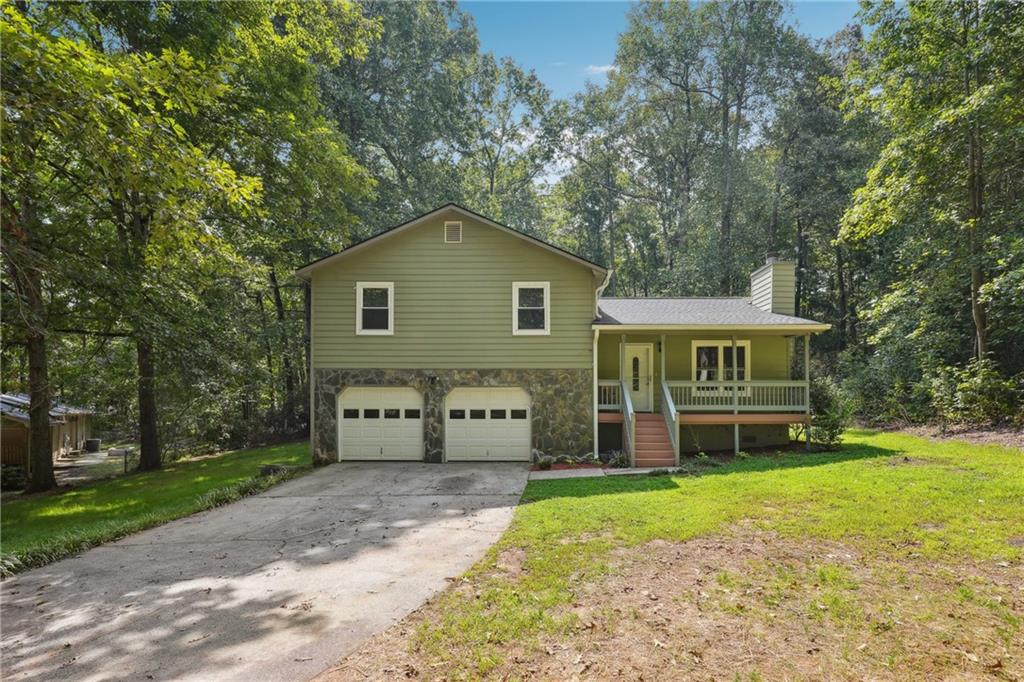 Adorable and move-in ready, this home has all the charm and updates you’ve been looking for. Step inside to find a beautifully renovated kitchen and baths paired with hardwood flooring throughout for a timeless feel. The screened-in porch is perfect for morning coffee or evening unwinding, while the large lot and huge backyard give you plenty of space to play, garden, or entertain. A 2-car garage adds everyday convenience to this picture-perfect home. Roof is only 2 years old!