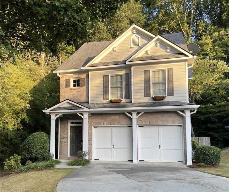 Welcome to 6000 Hunter Hall Ct, a private retreat on a cul-de-sac in one of Norcross’s most charming hidden communities. With only 12 homes on the street, this residence enjoys the most private lot, bordered by woods on two sides. You’re just a short stroll from Downtown Norcross, parks, concerts at Thrasher Park, local dining, and the family-friendly Cultivation Brewery, a perfect blend of seclusion and walkability.
Inside, the home is fully renovated and move-in ready, with fresh interior and exterior paint, new carpet, updated hardwoods, and modern smart-home features. The open-concept living area centers around a cozy gas fireplace and flows into a custom designer kitchen with quartz countertops, soft-close cabinetry with pull-out drawers, stainless appliances, and a large entertaining island.
The owner’s suite features a spa-like walk-in tile shower, dual vanities, and built-in tablets. Two additional bedrooms plus an updated bath offer flexibility for family, guests, or office use.
Step outside to a paver patio and wooded backdrop, creating a private, low-maintenance yard rarely found this close to downtown. Enjoy friendly neighborhood deer strolling by or listen to the birds while sipping your morning coffee. With landscaping included in a low HOA, at a fraction of the cost of nearby townhomes, you’ll enjoy convenience without compromise.
This home delivers the perfect mix of privacy, walkability, and modern living, fully turnkey and ready for you to move in and start enjoying immediately — a standout opportunity in Historic Norcross.
