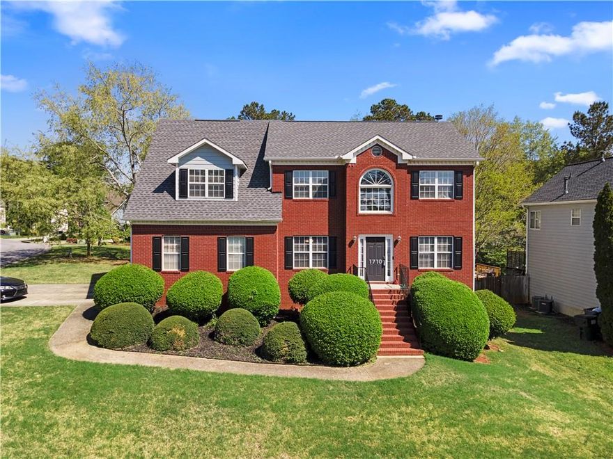 Welcome to this beautiful 4 bedroom, 2.5 bath traditional home, perfectly positioned on a large corner lot with a spacious level yard and endless potential. Inside you're greeted with a grand two story foyer that leads into a thoughtfully designed main level featuring a separate dining room, a cozy sitting room, a convenient laundry room, a half bath and at the heart of the home, you’ll find a large, stunning kitchen with unique cabinetry, gorgeous quartz countertops, a breakfast bar, and a bright eating area. The kitchen overlooks a warm and inviting living room with a fireplace, perfect for both everyday living and entertaining. Upstairs, the oversized primary suite offers a true retreat, complete with his and her walk-in closets, a luxurious ensuite bathroom with double vanities, and a private sitting area or reading nook. Three additional spacious bedrooms and a full hall bath complete the upper level. Need more space? The unfinished basement offers endless possibilities. Whether you are dreaming of additional bedrooms, a game room, home gym, or office space, the opportunity is yours. With a 2 car garage, timeless curb appeal, and a fantastic layout inside and out, this home has everything you need and more.