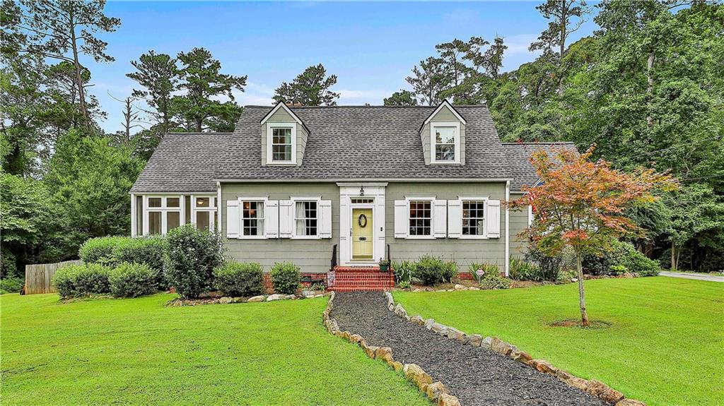 Charming 1937 Bungalow on almost 6 acres inside the City Limits of Fairburn. This Gorgeous home exudes character and it boasts a spacious Living Room, separate Dining Room, 3 bedrooms, Master on main, 2 full baths, 1/2 bath, office/study, Large kitchen, screened porch, separate laundry room, tons of closet space, a floored attic space for plenty of storage, or future expansion, and a 2 car garage with workshop. Owner has the original drawing from the architect who designed the home and the drawings will go with the purchase. Prepare to be Impressed with this ONE OF A KIND property that is located across from Duncan Park!