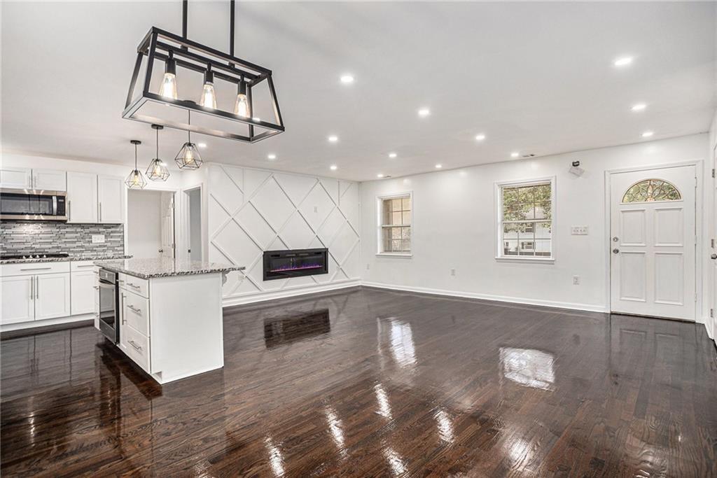 **$5,000 Buyer Incentive!**
Welcome to **"The Swansea"** – a fully renovated 4-bed, 2-bath home combining classic brick charm with modern upgrades. Features new roof, HVAC, electrical, plumbing, drywall, and more—offering the peace of mind of new construction.
Step into a spacious open-concept layout with hardwood floors, cozy fireplace, accent walls, and recessed lighting. The chef’s kitchen boasts granite counters, stainless appliances, custom cabinets, and a central island perfect for entertaining.
The serene primary suite includes a spa-like bath and a large walk-in closet. Three additional versatile bedrooms and a beautifully finished second bathroom provide space for family, guests, or office needs.
Outside, the backyard is a blank slate ready for your vision—garden, patio, or play area.