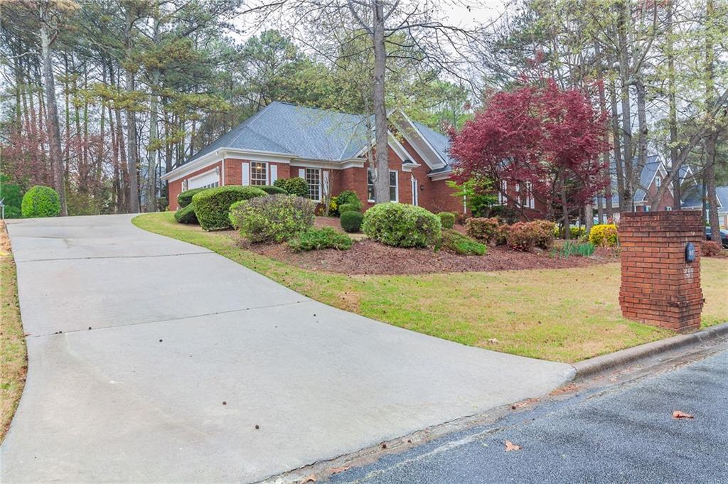 Welcome home to this newly renovated home in Northforke Plantation. This gorgeous 3 sided brick ranch with a partially finished basement has been refreshed with new HVAC, new interior paint, new carpet, refinished hardwoods, new tile in bathrooms and laundry room, new granite in kitchen and bathroom, freshly painted cabinets in kitchen and bathrooms and a new back deck. As you enter the home you are greated with a large living room with tall ceilings. The formal dining room is connected to a large kitchen with plenty of counter space and stainless steel appliances. The kitchen opens to an eating area that can access the back deck and a lovely living area with fireplace. A large laundry room and half bath round out this side of the home as well as a 2 car garage. The primary suite is tucked away in the back for privacy and has a new soaking tub, seperate shower and double vanities. On the front side of the home are 2 secondary bedrooms, each with their own full bathrooms. Downstairs you will find 2 large finished rooms and an unfinished area for storage. Dont miss this beautiful home!!!