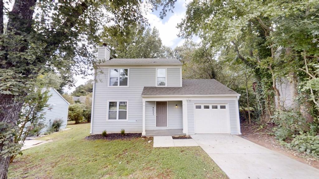 Welcome to this beautifully updated home in the desirable Laurel Oaks community! Freshly painted throughout, this charming residence offers a spacious and inviting layout with luxury tile flooring on the main level and plush carpet upstairs for added comfort. The cozy family room features a warm fireplace flanked by custom built-in shelving, creating the perfect space for relaxing or entertaining. The modern kitchen boasts white cabinetry, granite countertops, and stainless steel appliances, ideal for any home chef. Upstairs, you'll find three comfortable bedrooms, including a generous primary suite. Step outside to enjoy a large private backyard and rear deck perfect for entertaining guests or enjoying quiet evenings outdoors. Don't miss your chance to own this beautiful home in Laurel Oaks schedule your showing today!