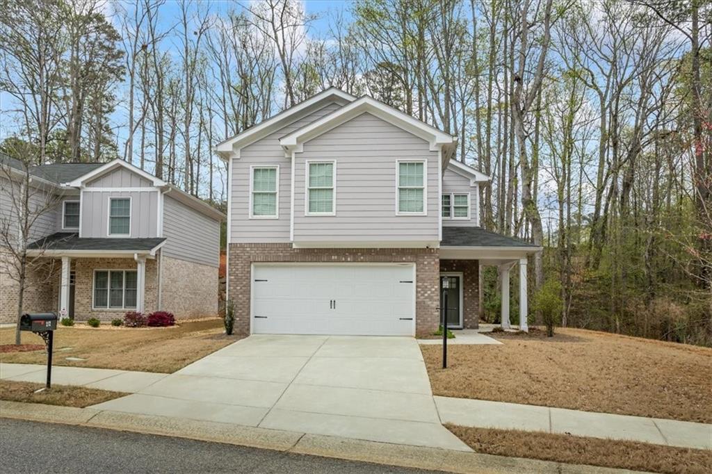 Welcome home to your like-new 4 BR 2.5BA home in Huntington Shoals in West Athens. The interior features an open floor plan with high ceilings, a family room with an electric fireplace, and a kitchen equipped with granite countertops and quality cabinetry. The upper level master suite includes a soaking tub, separate shower and double vanity. The three additional bedrooms are spacious with ample closet space. The property also includes an attached garage, front & side porch with a second entrance. You are situated on a 0.57-acre lot next to a stream so you can rest easy with neighbors on one side only!