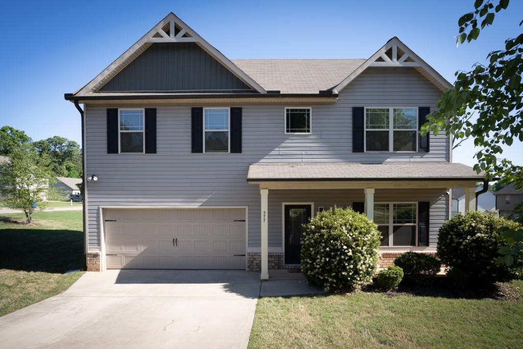 577 Joneus Drive - Welcome to this beautiful home in McDonough that is set on a corner lot with tons of curb appeal. Upon entering, the 2-story foyer leads to the family room and kitchen with 9 ft ceilings and plenty of natural light. The inviting kitchen is full of custom finishes including a built-in dining area. The upper-level secondary bedrooms are filled with natural light and are generously sized. The primary bedroom is a truly spacious retreat with tray ceilings, updated en-suite bath with custom touches that make everything feel that much more like home. Large, flat backyard is perfect for all your favorite outdoor activities. Home is just a 15-minute drive to either Jonesboro Road or down to Tanger Outlet in Locust Grove for all your shopping needs. And did I mention NO HOA!!! Schedule a showing today: don't miss out on this beautiful home!