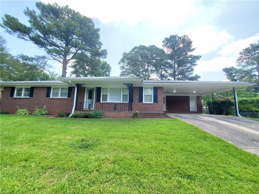 Peaceful ranch home on a large lot with enormous fully fenced backyard. Far enough away to not deal with the hustle and bustle, but close enough to have access to Powder Springs and Smyrna shopping and dining. Enter the home to a nice, open living area that connects the living areas. Separate office nook would be great if you work from home! Nice kitchen with plenty of counter space and storage. Relaxing covered patio and towering trees make this one truly feel like home! This home accepts pets on a case by case basis with a non-refundable pet fee. Available now!