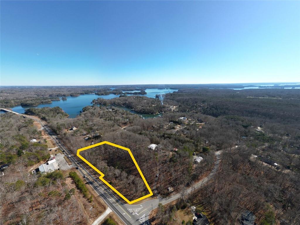 Discover this recently subdivided 3.4 +/- acre lot, located in the sought-after East Forsyth County school district. Currently zoned A1 Agricultural zoning, this property offers flexible options for your design/build project. Enjoy the perfect blend of tranquility and convenience - 10 minutes to shopping, dining, and groceries at the North Georgia Premium Outlets. Under 5 minutes to Lake Lanier's Little Hall Park with a boat ramp and recreational opportunities. This lot provides ample level space for parking your RV, boat, or other toys, making it ideal for outdoor enthusiasts or hobbyists. Bring your vision to life in this exceptional location.