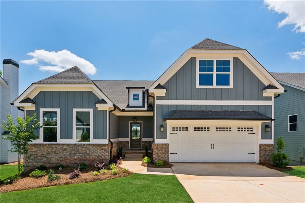 Best Basement Value in Traditions of Braselton!!! Wonderful home with room to grow! The Summerwind Plan features an elegant entryway with cove molding, split bedroom plan is ideal for multi-use. Open concept kitchen and family room with elegant tile backsplashes, granite countertops, single basin sink, pendant lights. Judges paneling trim in cafe/dining area. Covered back deck is perfect for entertaining and viewing the tree-lined sunsets. Downstairs unfinished basement is like a whole other house! Stubbed for future bathroom and full daylight.