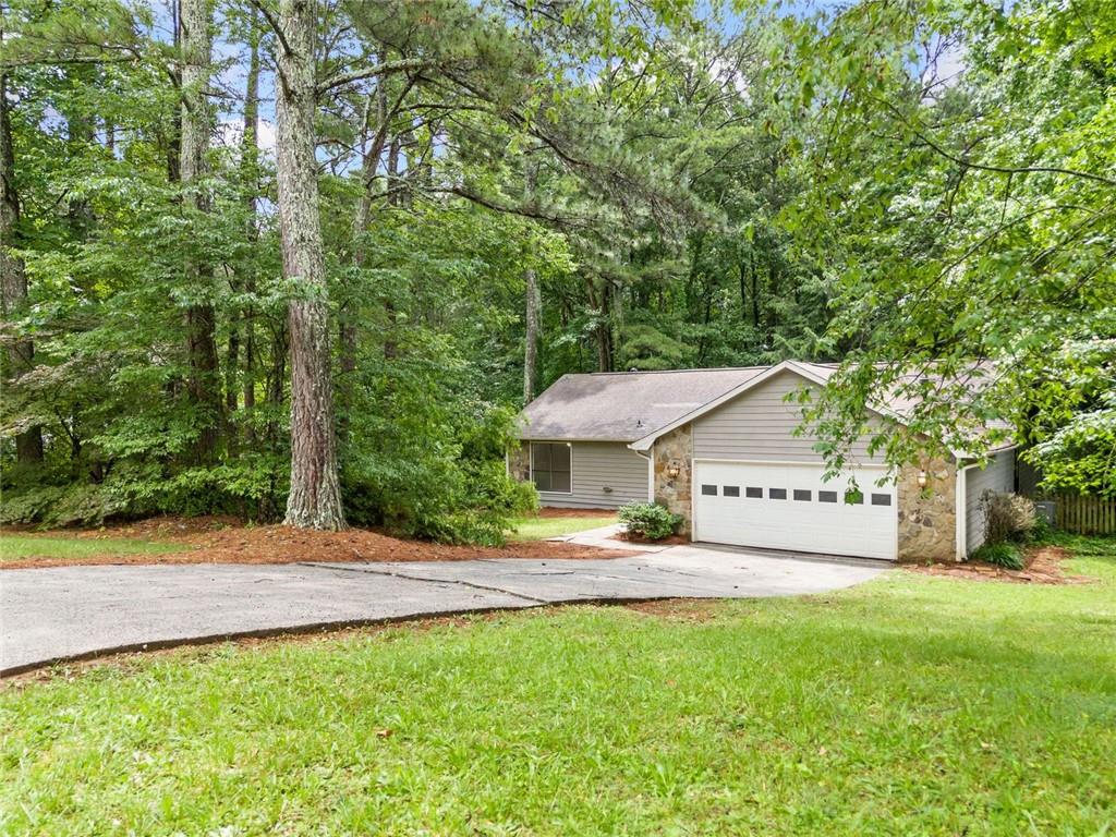 Welcome to 845 Creek View Trail a beautifully updated, move-in-ready home nestled in a quiet, established Kennesaw neighborhood with no HOA. As you step through the front door, you're greeted by a spacious living room featuring a cozy fireplace, perfect for relaxing evenings. The separate dining room offers an ideal space for entertaining guests or enjoying family meals. The kitchen boasts granite countertops, a gas stove, a walk-in pantry, and ample cabinetry, catering to all your culinary needs. The primary suite includes a walk-in closet and his and hers closets, providing generous storage space. Significant updates enhance the home's value and efficiency: a new roof (2020), HVAC system (2023), furnace (2024), and water heater (2019) with a new expansion tank added in 2023. A brand-new driveway drain has been installed in front of the garage door, ensuring proper water management. Situated on a spacious lot, this home offers a peaceful setting while being conveniently close to local amenities. Enjoy nearby attractions such as Kennesaw Mountain National Battlefield Park, Noonday Creek Trail, and Swift-Cantrell Park .
Don't miss the opportunity to own this charming home in a prime Kennesaw location. Schedule your private tour today!